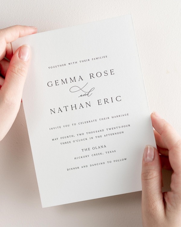 Bride holding her 5x7” Gemma letterpress wedding invitation.