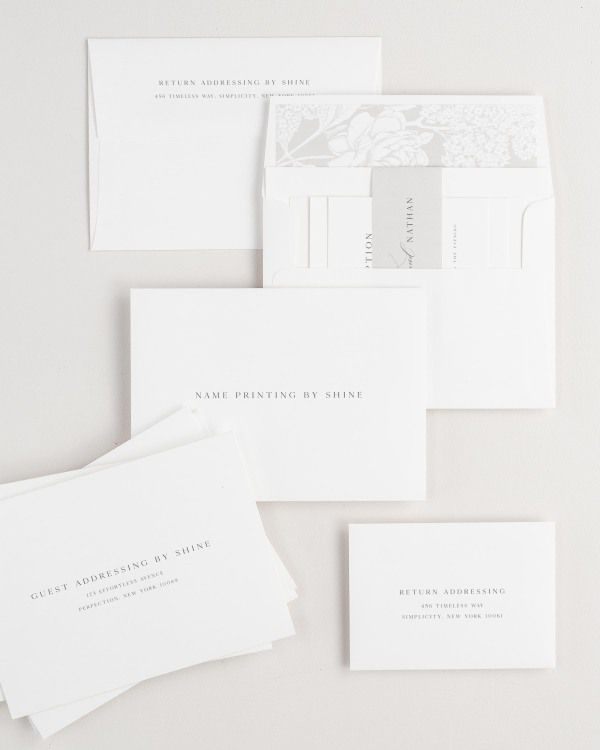 Gemma wedding invitation envelopes with guest addressing, return addressing, and name printing services. Inner envelope features a hydrangea liner and stone belly band.