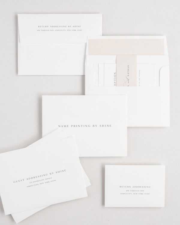 Gemma wedding invitation envelopes with guest addressing, return addressing, and name printing services. Inner envelope features a solid liner and rose gold belly band.