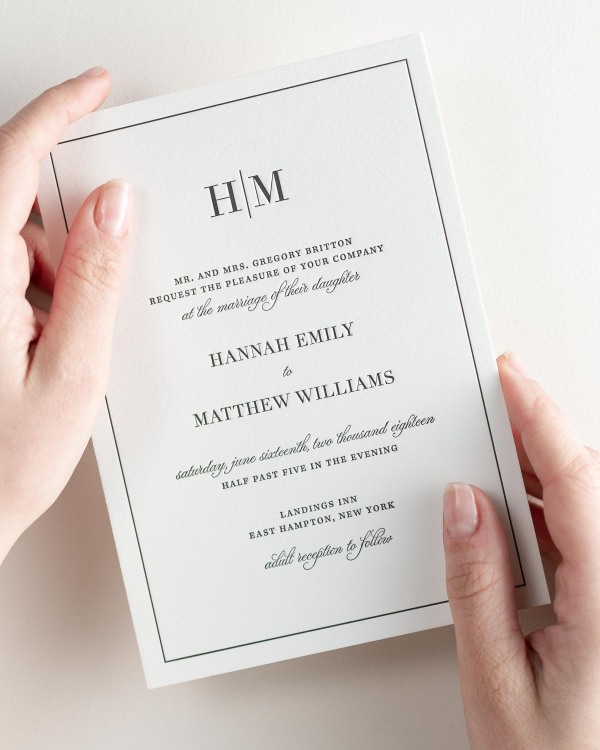 Bride holding her 5x7” Glam Monogram letterpress wedding invitation.