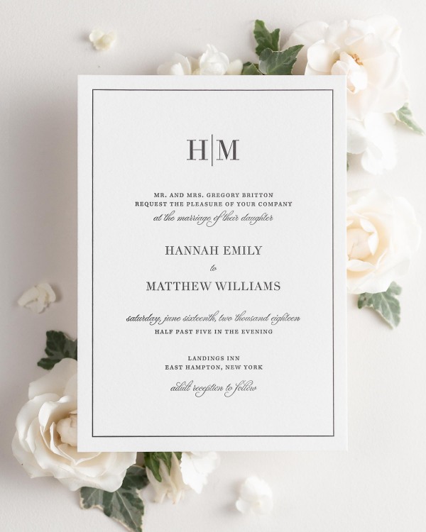 Glam Monogram letterpress wedding invitation styled with pretty florals.