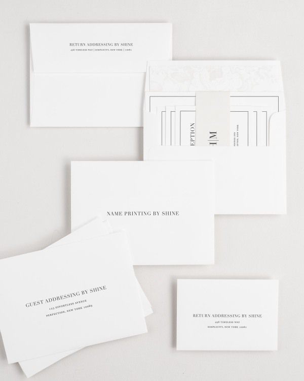 Glam Monogram wedding invitation envelopes with guest addressing, return addressing, and name printing services. Inner envelope features a garden rose liner and nude belly band.