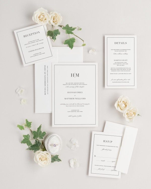 Glam Monogram wedding invitations flat lay with