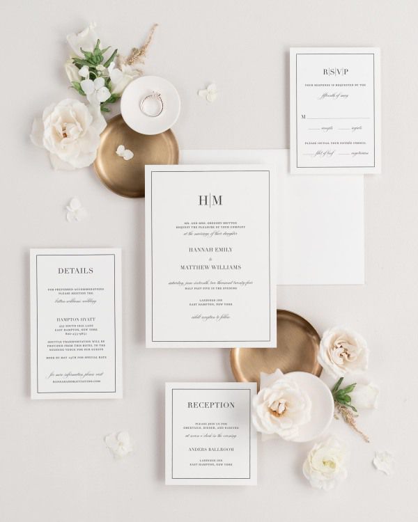 Glam Monogram wedding invitations flat lay with
