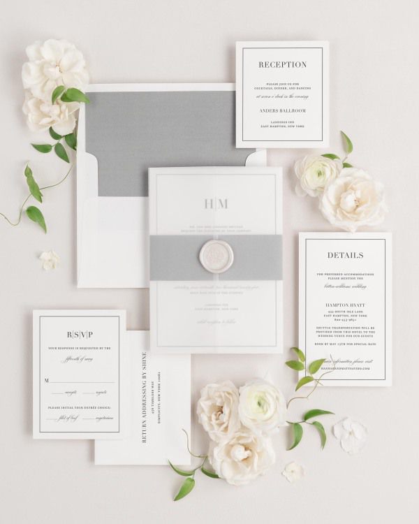 Glam Monogram wedding invitations flat lay with slate solid liner, translucent vellum jacket, and pearl florette wax seal.
