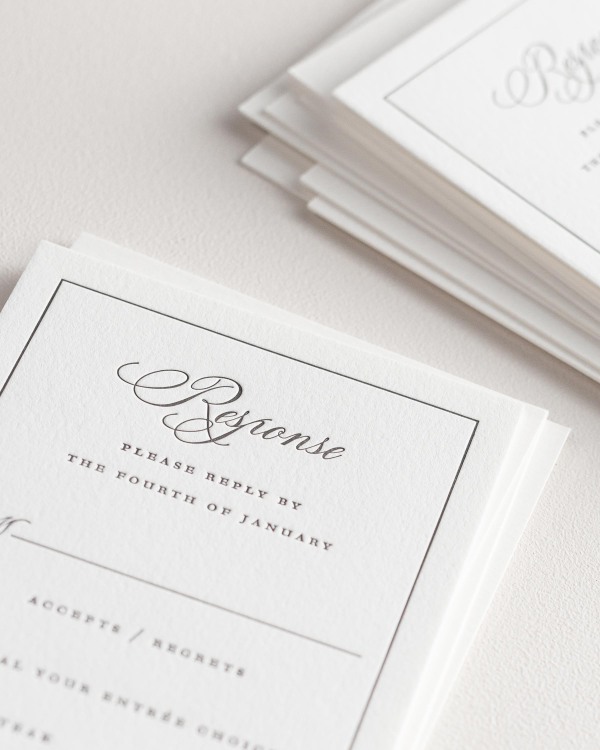 Dreamy close up shot of Grace response cards. Deep impressions in the paper are a result of the letterpress printing process.