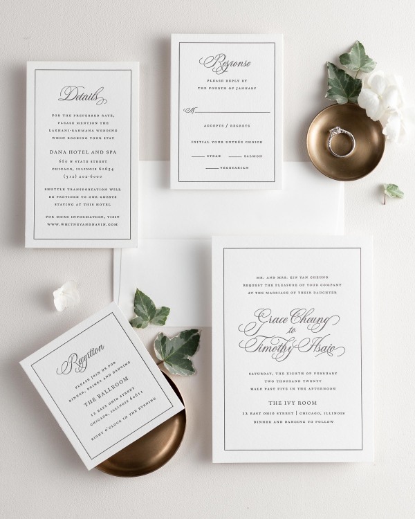 All pieces of the Grace letterpress wedding invitation suite, including the invitation, small and large enclosures, and response card.