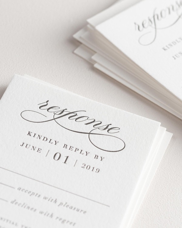 Dreamy close up shot of Haley response cards. Deep impressions in the paper are a result of the letterpress printing process.