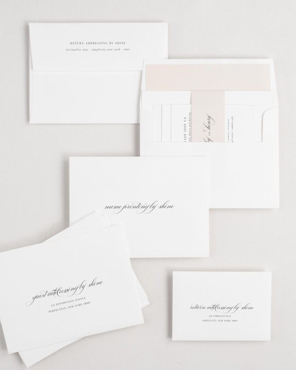 Haley wedding invitation envelopes with guest addressing, return addressing, and name printing services. Inner envelope features a solid liner and rose gold belly band.