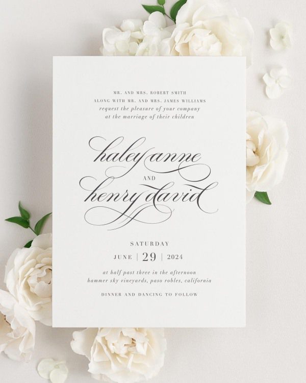 Haley wedding invitation framed with dreamy florals.