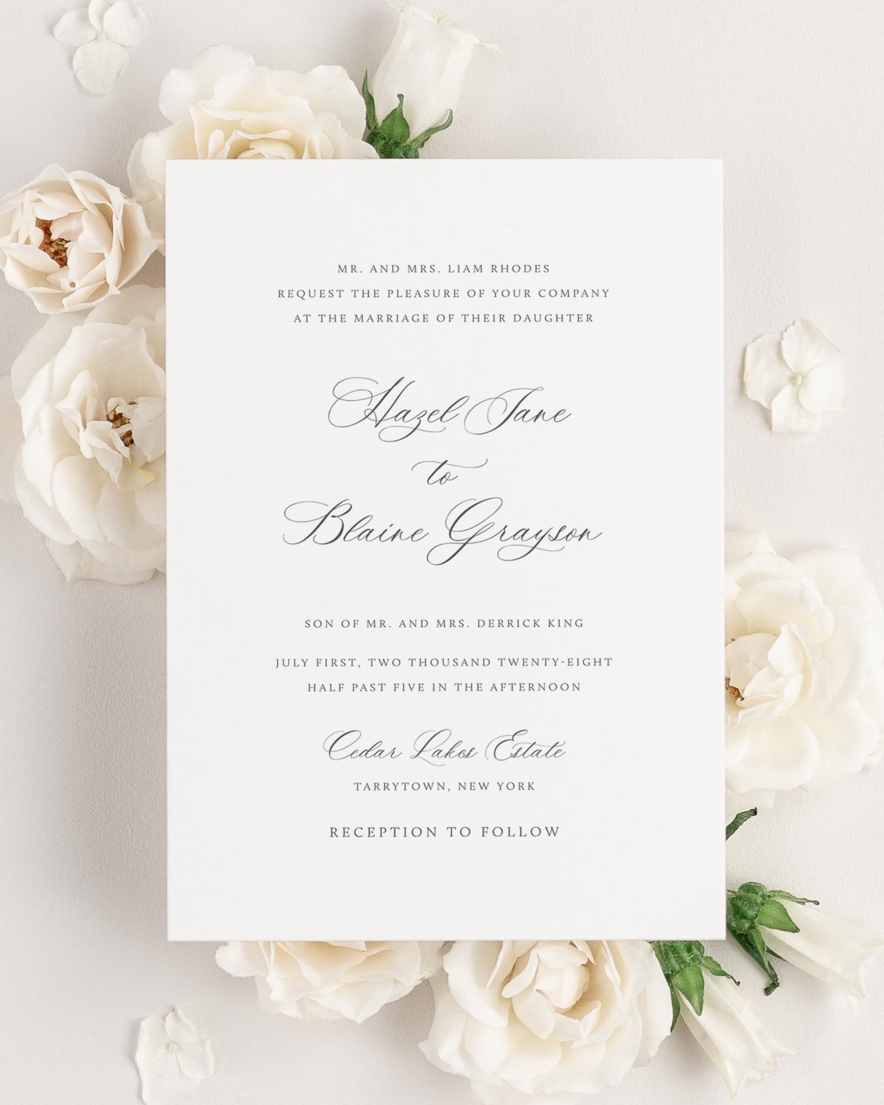 Hazel wedding invitation framed with dreamy florals.