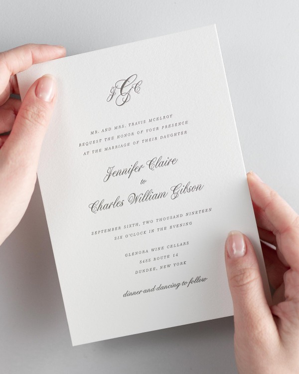Bride holding her 5x7” Jennifer letterpress wedding invitation.