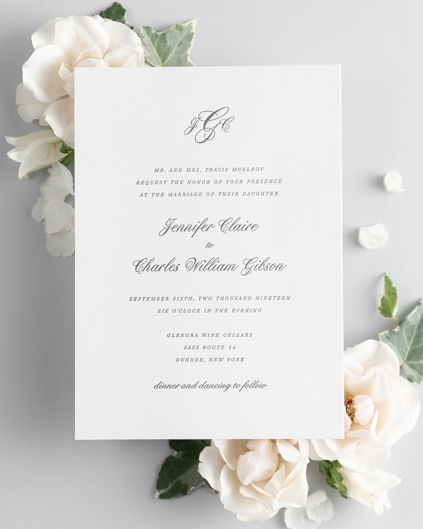 Jennifer letterpress wedding invitation styled with pretty florals.