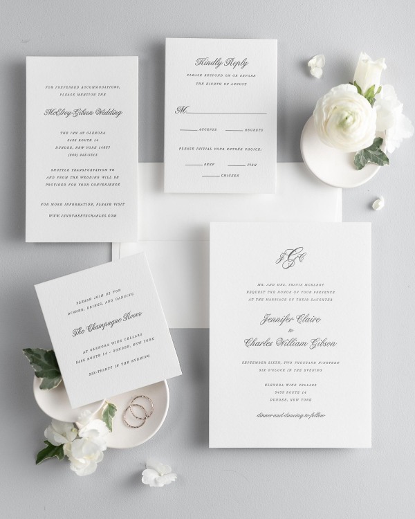 All pieces of the Jennifer letterpress wedding invitation suite, including the invitation, small and large enclosures, and response card.