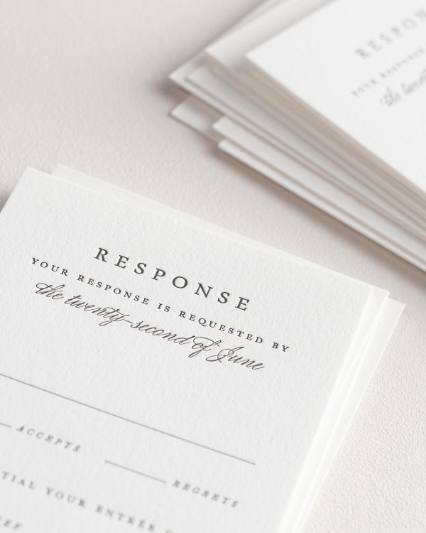 Dreamy close up shot of Jessica response cards. Deep impressions in the paper are a result of the letterpress printing process.