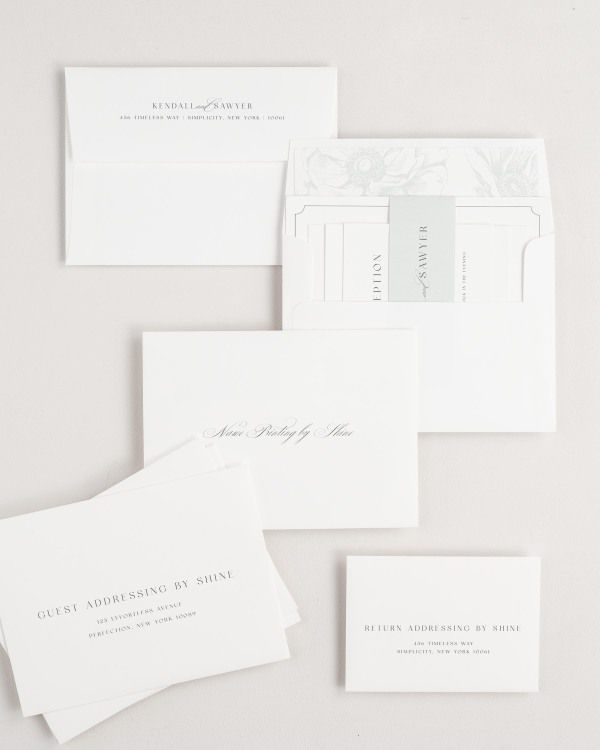 Kendall wedding invitation envelopes with guest addressing, return addressing, and name printing services. Inner envelope features a anemones liner and sea salt belly band.