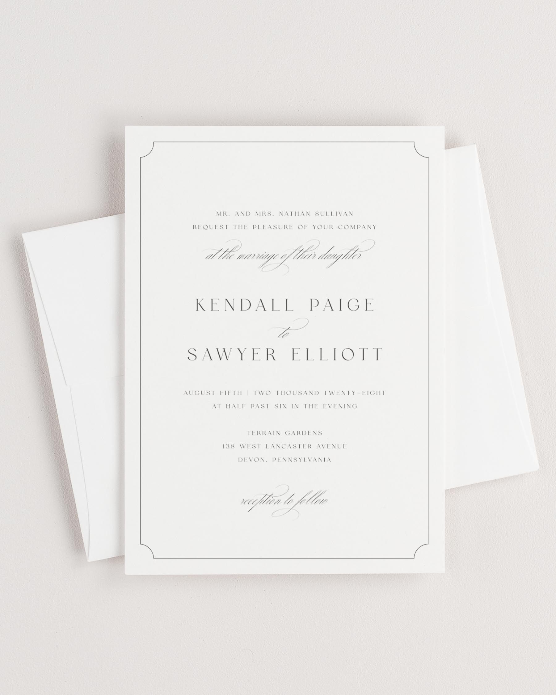 Simple close-up of Kendall invitation with an envelope.