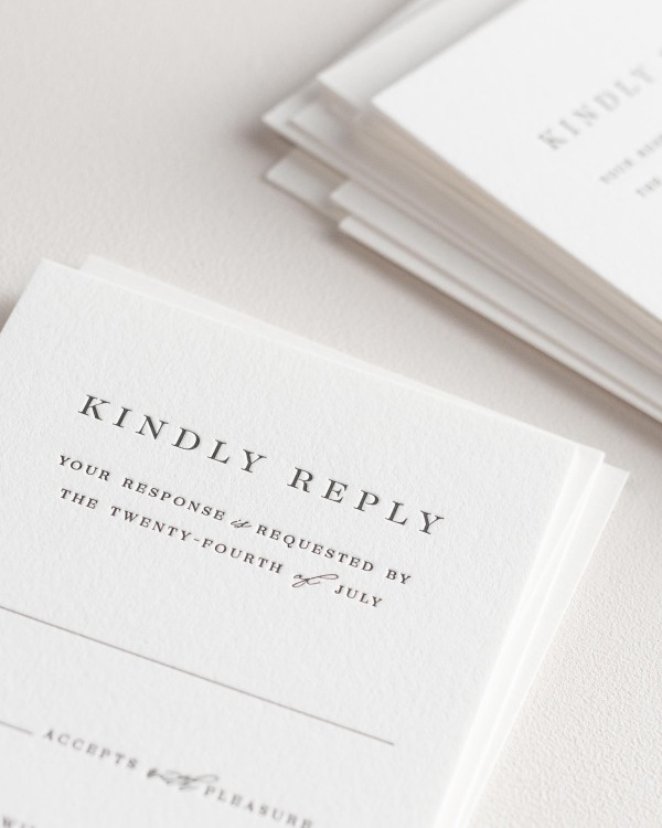Dreamy close up shot of Leighton response cards. Deep impressions in the paper are a result of the letterpress printing process.