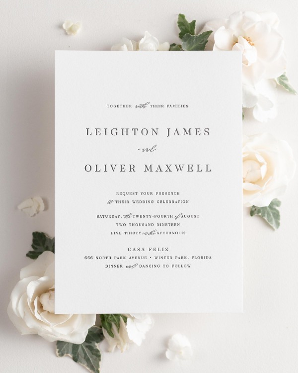 Leighton letterpress wedding invitation styled with pretty florals.