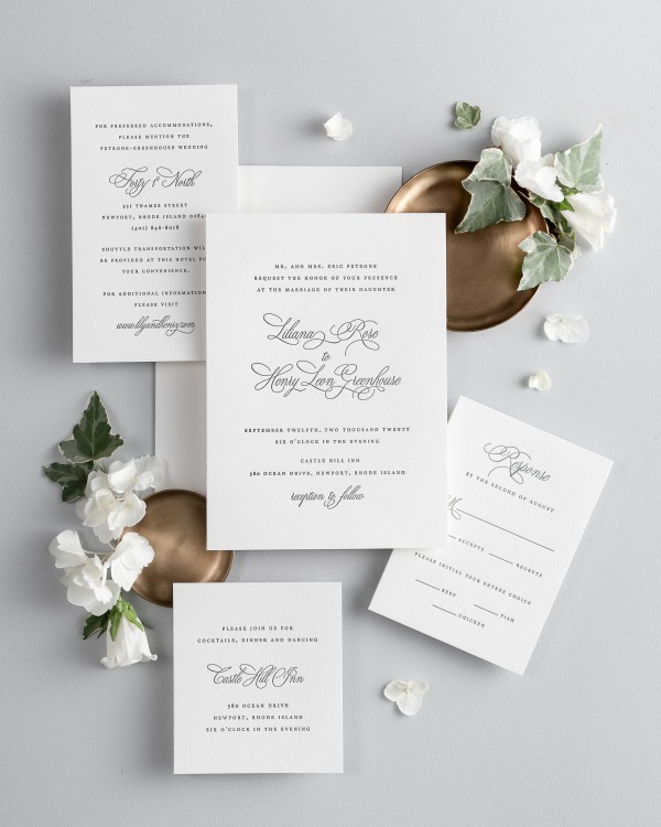 All pieces of the Liliana letterpress wedding invitation suite, including the invitation, small and large enclosures, and response card.