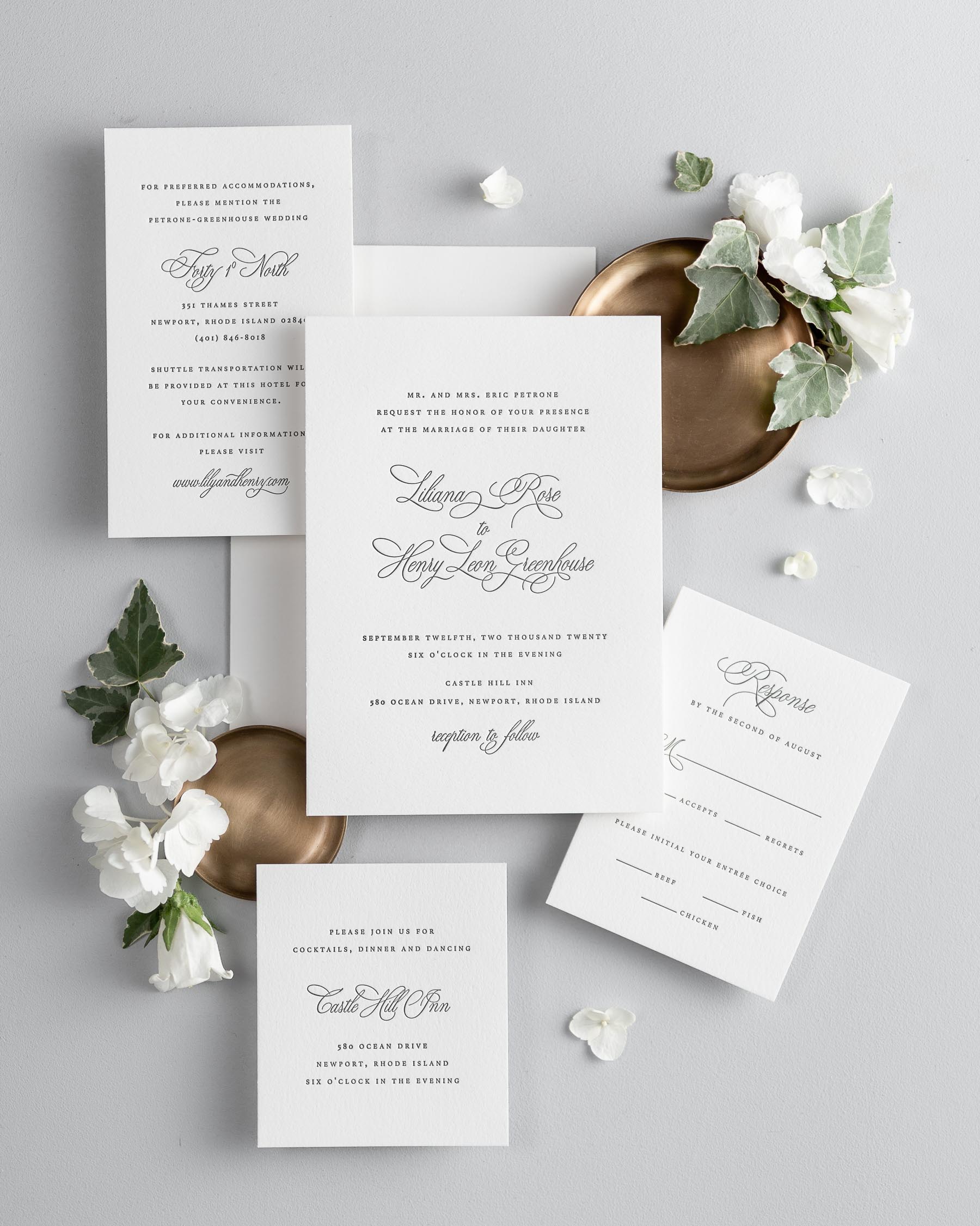 All pieces of the Liliana letterpress wedding invitation suite, including the invitation, small and large enclosures, and response card.