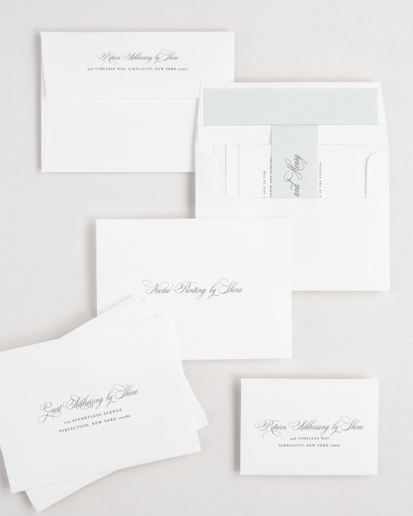Liliana wedding invitation envelopes with guest addressing, return addressing, and name printing services. Inner envelope features a solid liner and sea salt belly band.