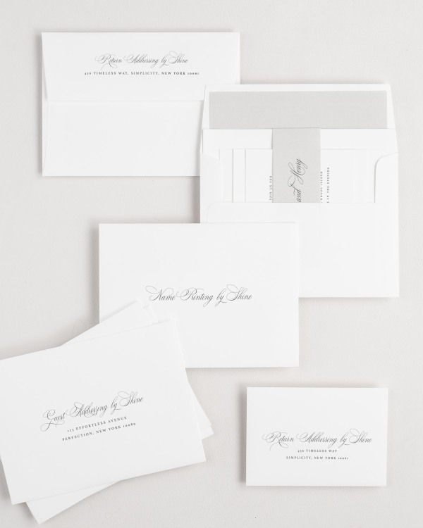 Liliana wedding invitation envelopes with guest addressing, return addressing, and name printing services. Inner envelope features a solid liner and stone belly band.