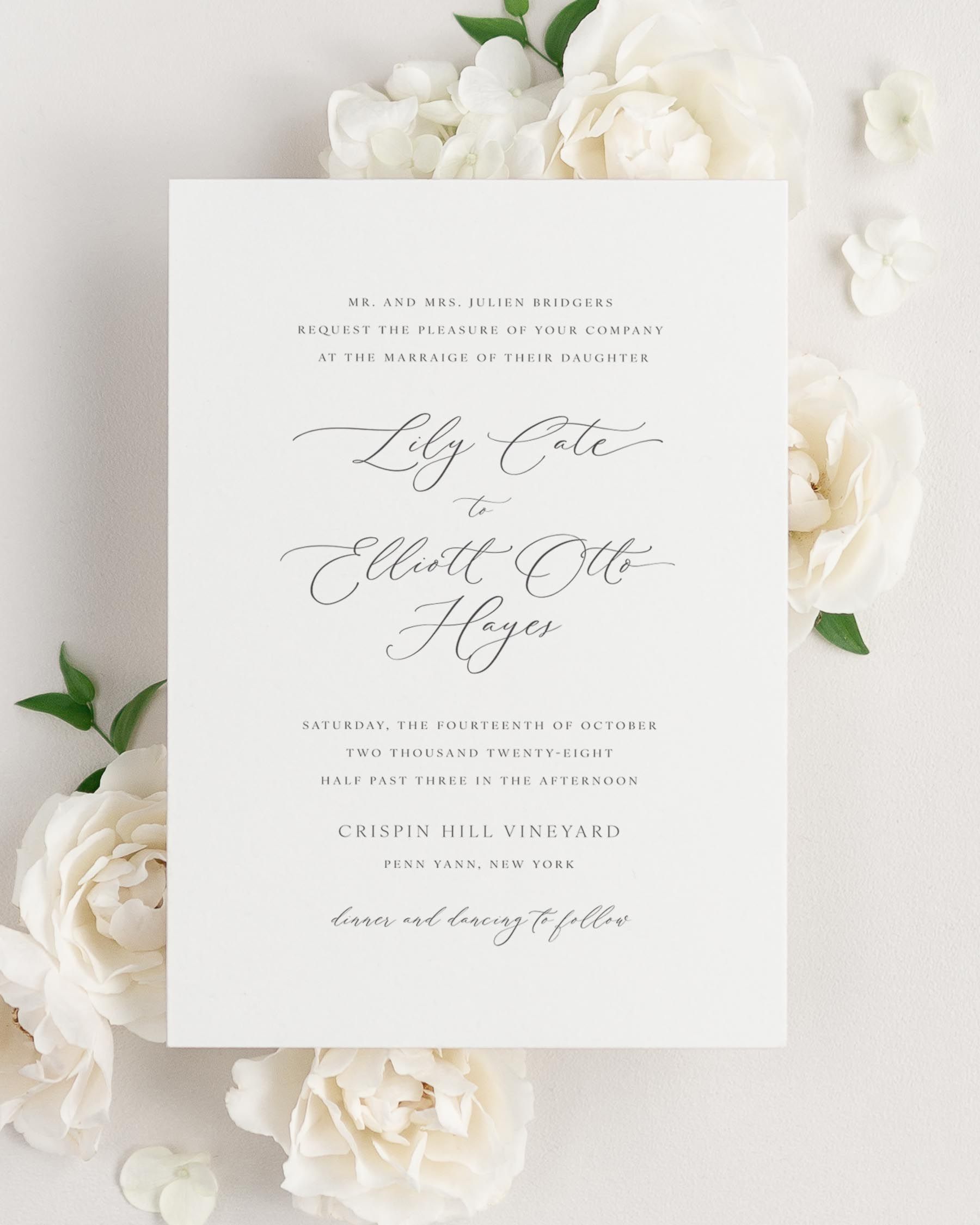 Lily wedding invitation framed with dreamy florals.