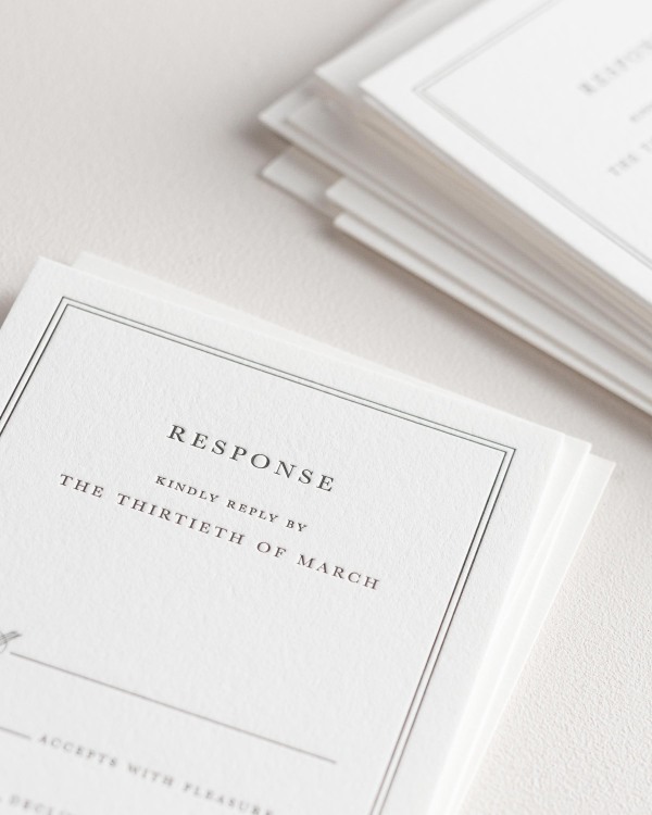 Dreamy close up shot of Mackenzie response cards. Deep impressions in the paper are a result of the letterpress printing process.