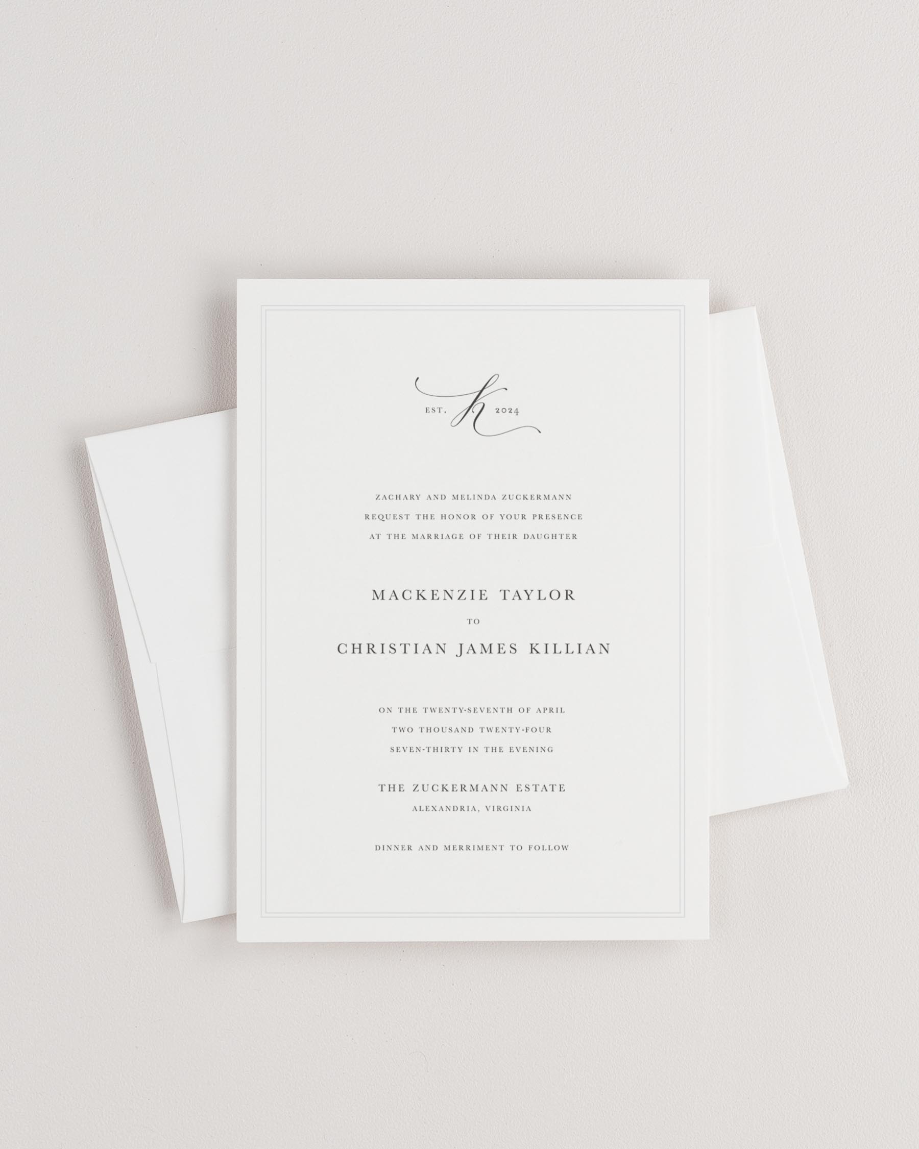 Simple close-up of Mackenzie invitation with an envelope.