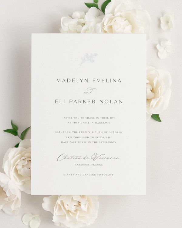 Madelyn wedding invitation framed with dreamy florals.