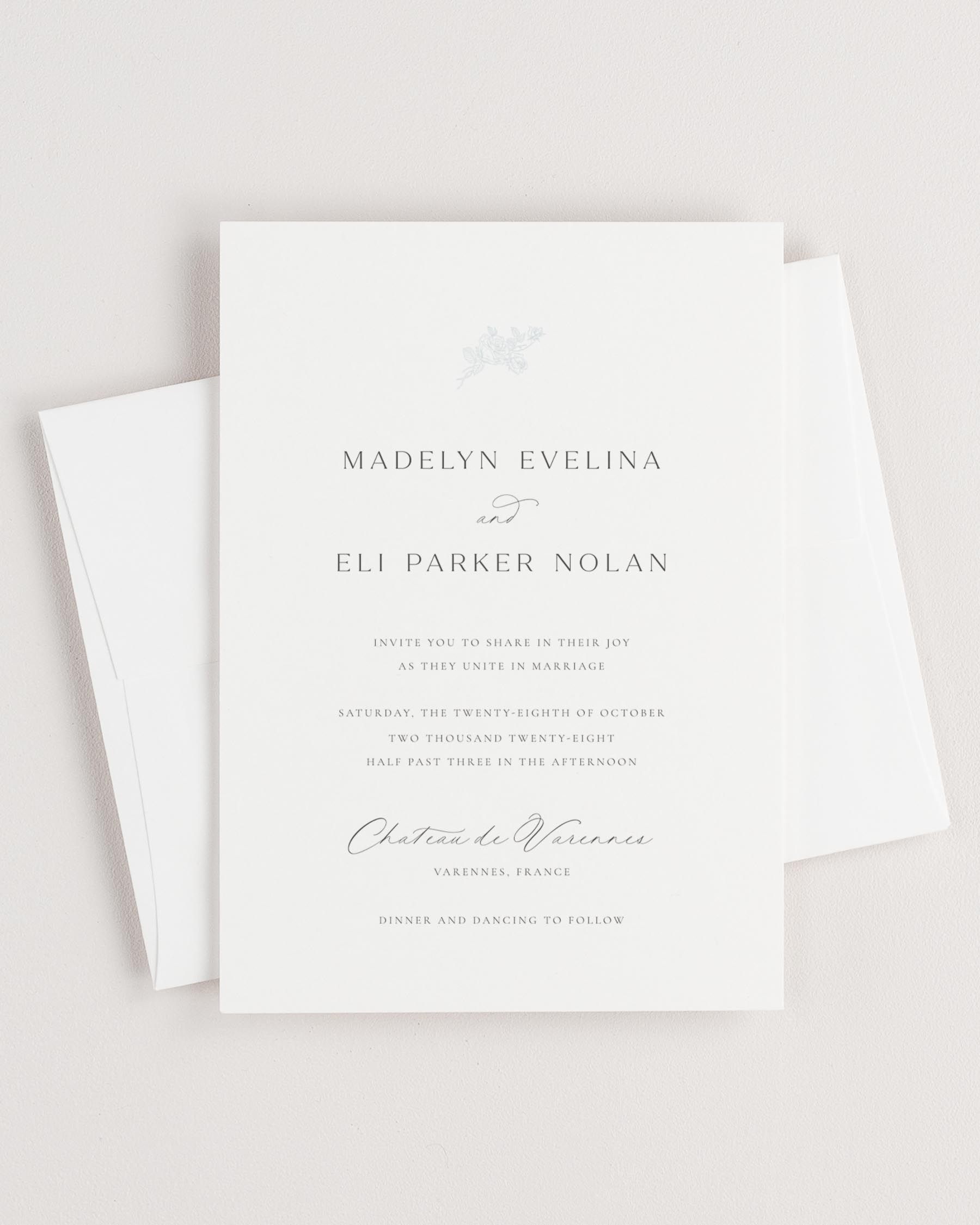 Simple close-up of Madelyn invitation with an envelope.