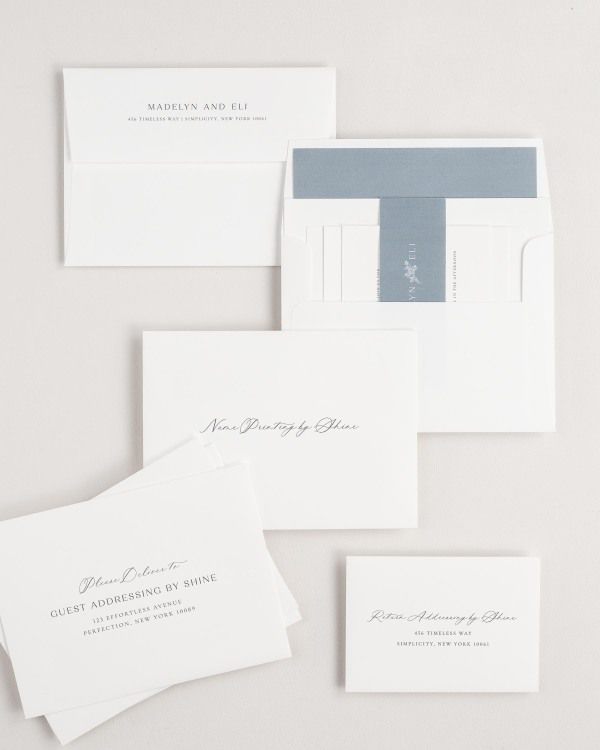 Madelyn wedding invitation envelopes with guest addressing, return addressing, and name printing services. Inner envelope features a solid liner and mineral belly band.