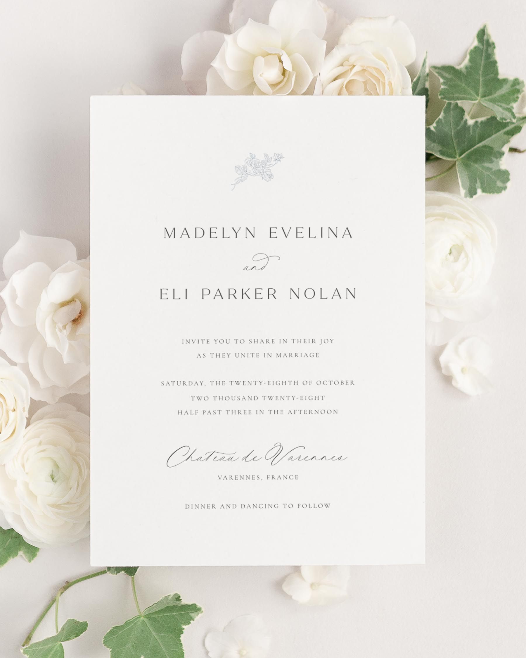 Madelyn wedding invitation framed with dreamy florals.