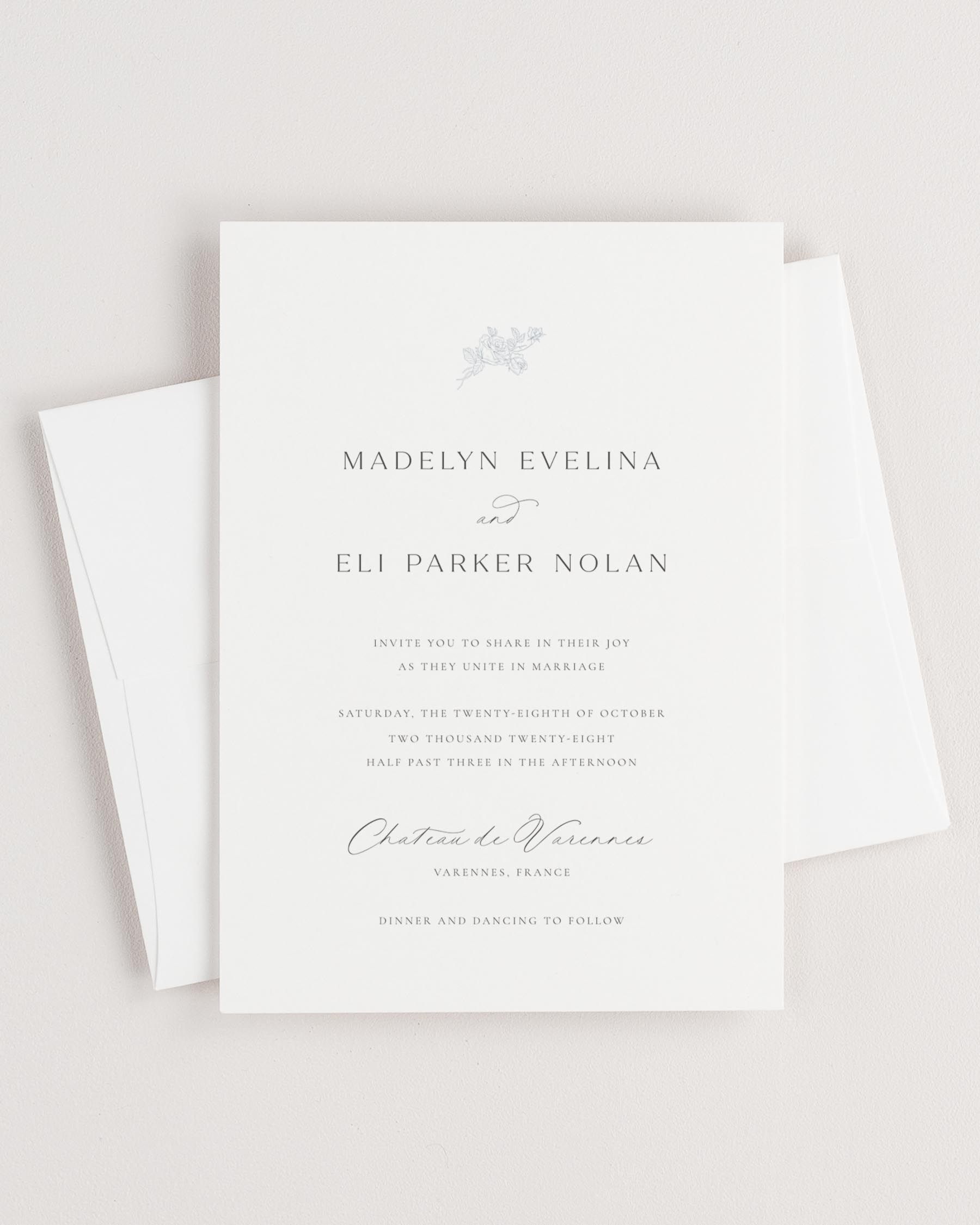 Simple close-up of Madelyn invitation with an envelope.