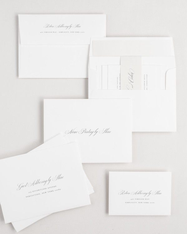 Nadia wedding invitation envelopes with guest addressing, return addressing, and name printing services. Inner envelope features a solid liner and nude belly band.