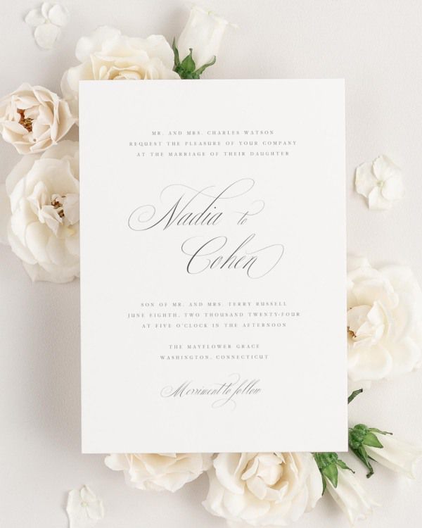 Nadia wedding invitation framed with dreamy florals.