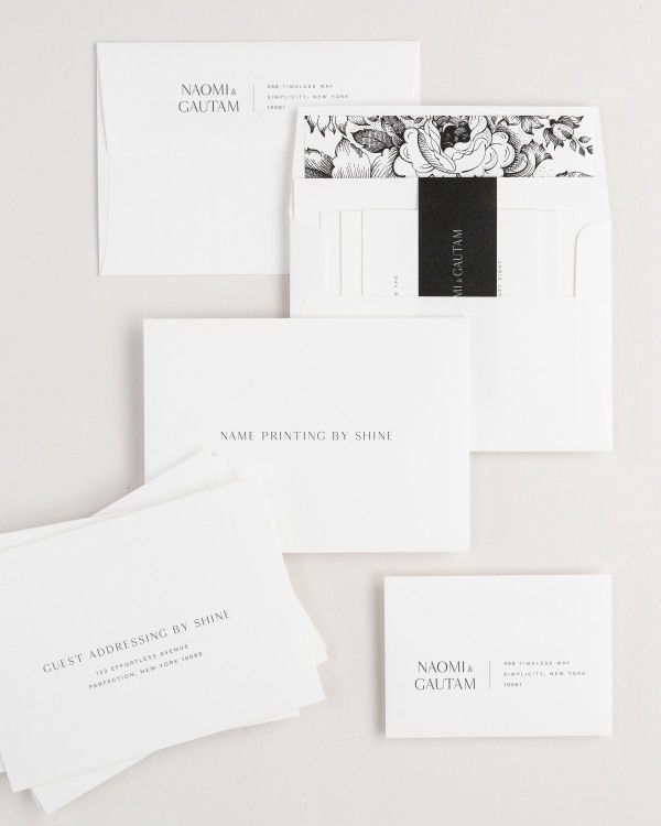 Naomi wedding invitation envelopes with guest addressing, return addressing, and name printing services. Inner envelope features a garden rose liner and black belly band.