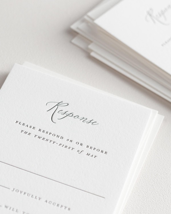 Dreamy close up shot of Natalie response cards. Deep impressions in the paper are a result of the letterpress printing process.