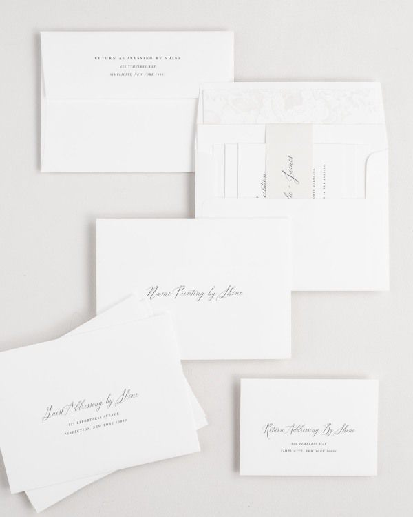 Natalie wedding invitation envelopes with guest addressing, return addressing, and name printing services. Inner envelope features a garden rose liner and nude belly band.