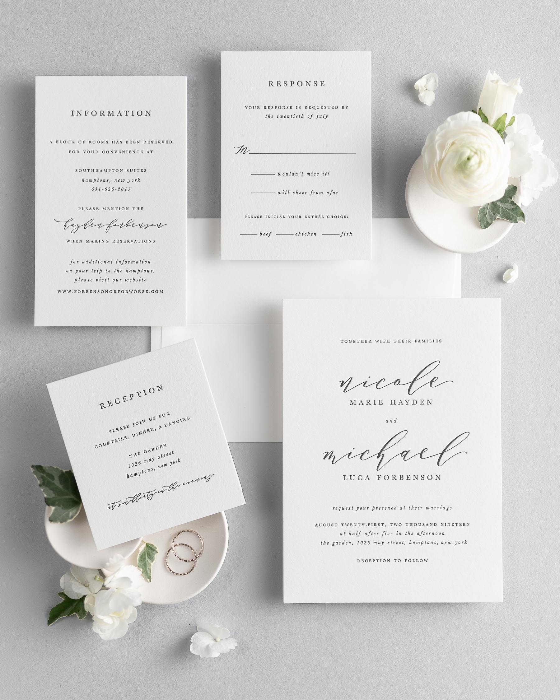 All pieces of the Nicole letterpress wedding invitation suite, including the invitation, small and large enclosures, and response card.
