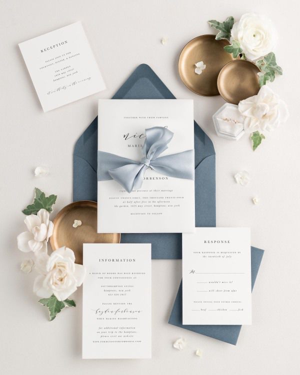 Wedding invitations with silk ribbon and chambray blue envelope
