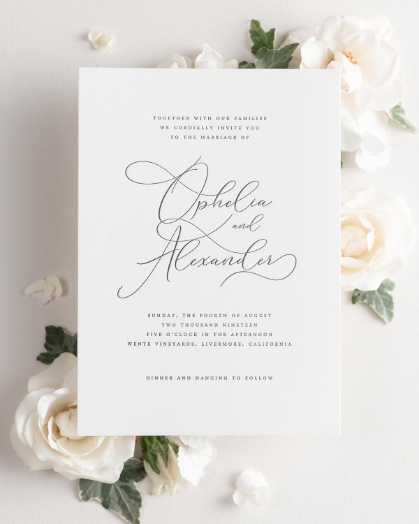 Ophelia letterpress wedding invitation styled with pretty florals.