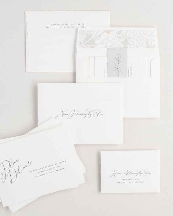 Ophelia wedding invitation envelopes with guest addressing, return addressing, and name printing services. Inner envelope features a hydrangea liner and stone belly band.