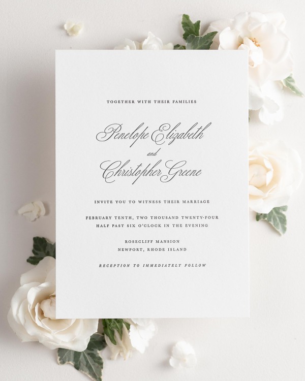 Penelope letterpress wedding invitation styled with pretty florals.