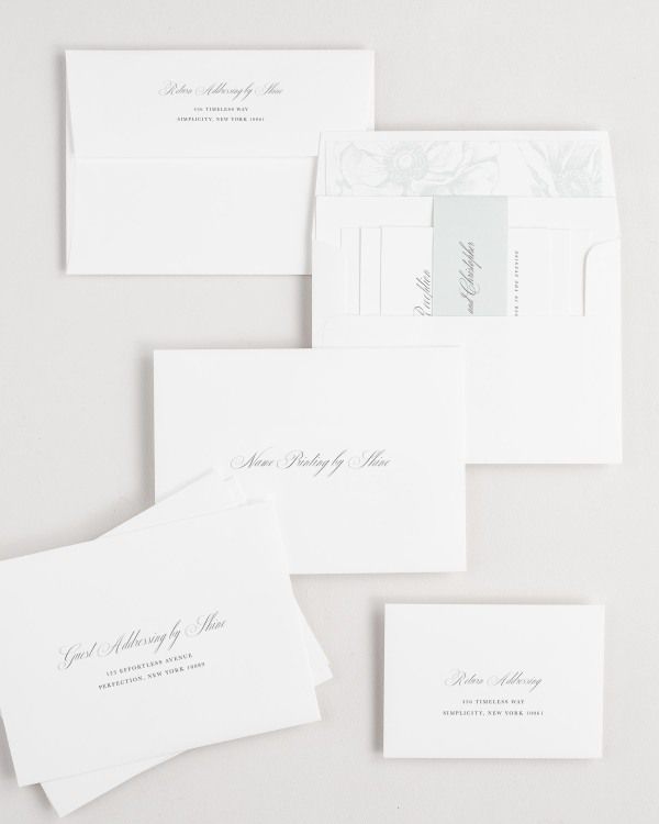 Penelope wedding invitation envelopes with guest addressing, return addressing, and name printing services. Inner envelope features a anemones liner and sea salt belly band.