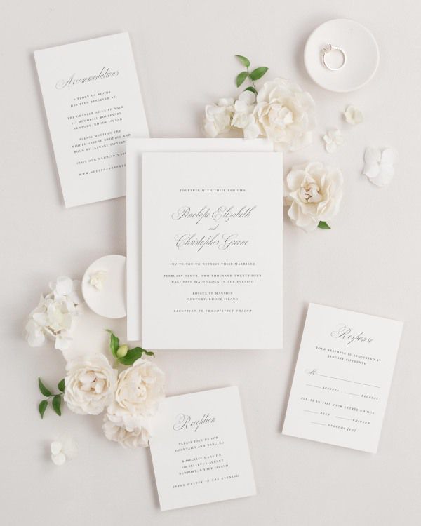 Penelope wedding invitations flat lay with
