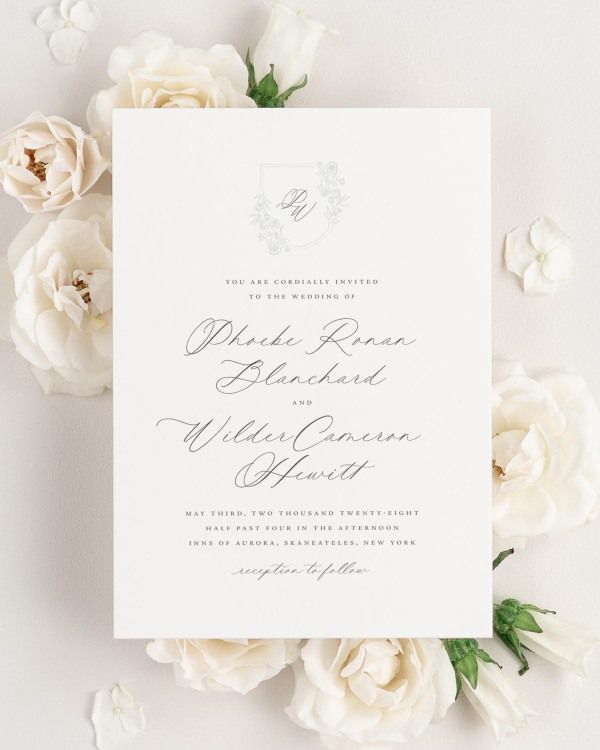 Phoebe wedding invitation framed with dreamy florals.