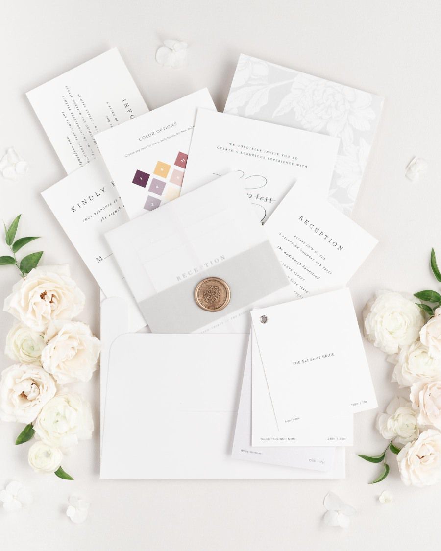 Shine Wedding Invitations sample kit with invitation suite, color chart, and paper swatch book