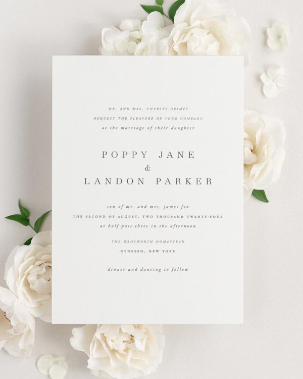 Poppy wedding invitation framed with dreamy florals.
